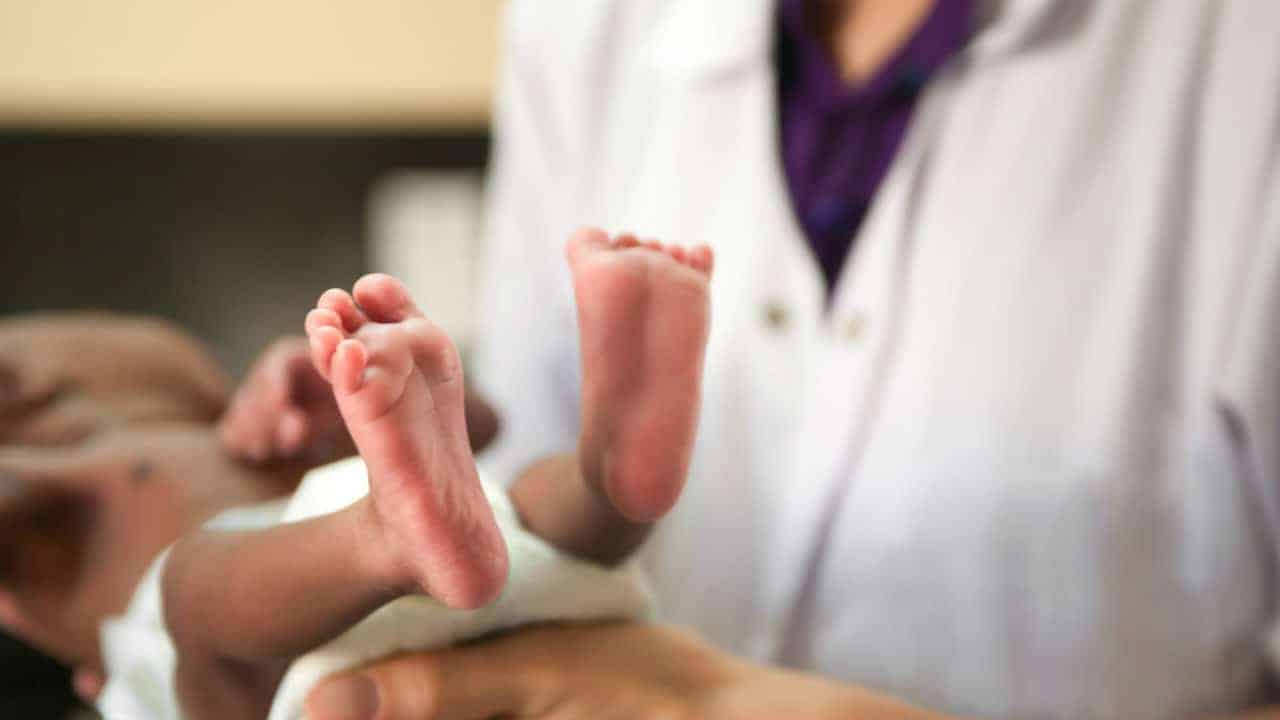 chicago nurse holding newborn